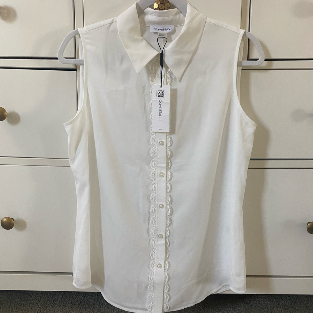 White Calvin Klein button down sleeveless blouse